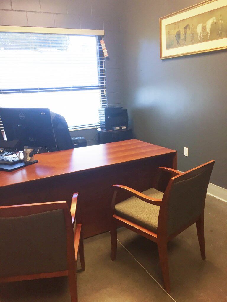 Used L-Desk and Wood Frame Chairs in Private Office
