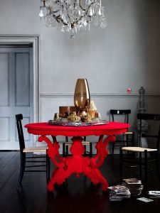 This table is much more elaborate, but we love the red and grey color scheme.