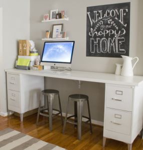 Metal legs add style to this all white file desk.  Notice the support bracket mounted to the wall.